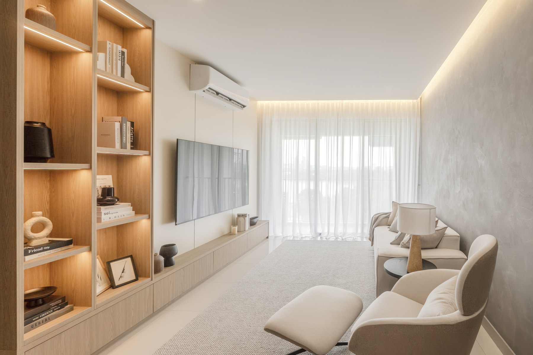 Type D living room with a wall-mounted television and sheer curtains